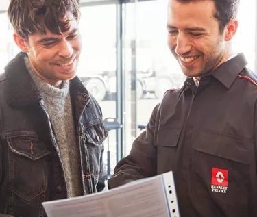 A customer and a mechanic discussing